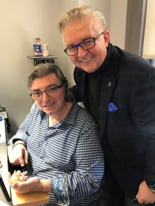 Dr. John Heimke and a patient in a dental office, showcasing personalized care in cosmetic dentistry.
