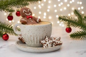 Gingerbread cookie figure resting on a festive cup of hot cocoa, surrounded by holiday decorations and lights, illustrating cozy seasonal drinks.