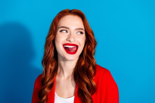 red haired model with white teeth