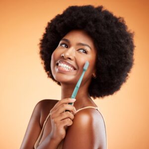 beautiful woman holding toothbrush