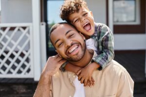 man with braces and child
